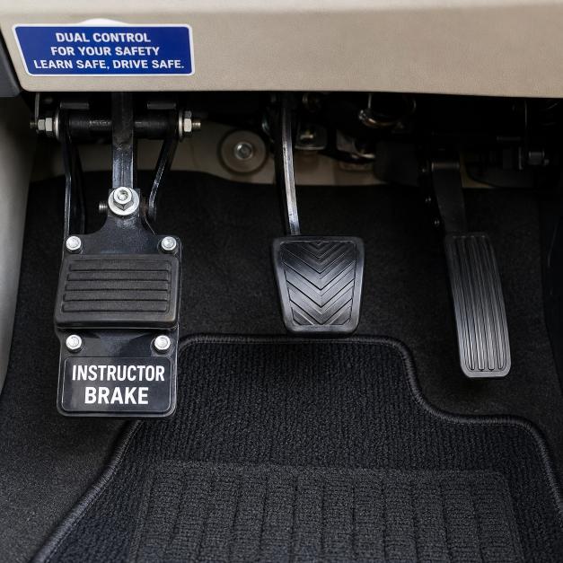Dual-control pedals fitted to a Jalaram Driving School training car